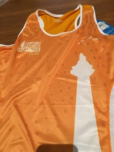 Orange running singlet for the race featuring the National Monument, MONAS