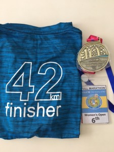Back view of finisher tee and medal