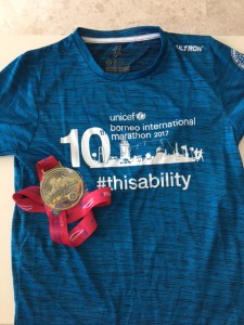 Front view of the finisher tee and medal